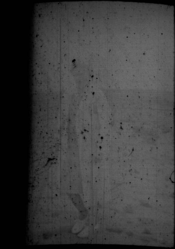 Unidentified woman (Peters relative?) standing in the desert