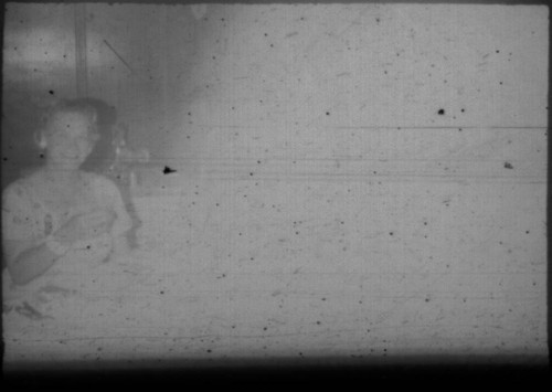 Unidentified woman seated at table