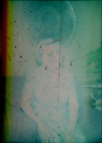 Unidentified woman seated on a couch