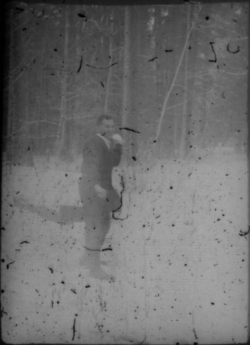 Unidentified man (Peters relative?) throwing snowball