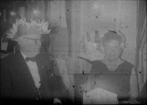 Unidentified man and woman wearing party attire aboard the M/S Stella Polaris