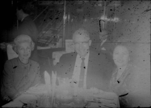 Alice Peters with unidentified man and woman at a restaurant