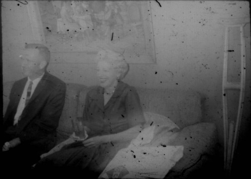 Unidentified man and woman (Peters relatives?) seated on a couch