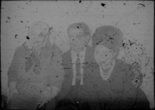 Two unidentified women and man