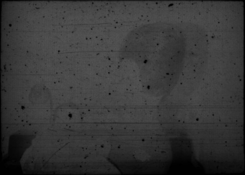 Unidentified woman and infant seated on a couch (Peters relatives?)