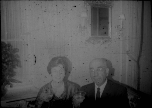 Leon and Alice Peters toasting with drinks