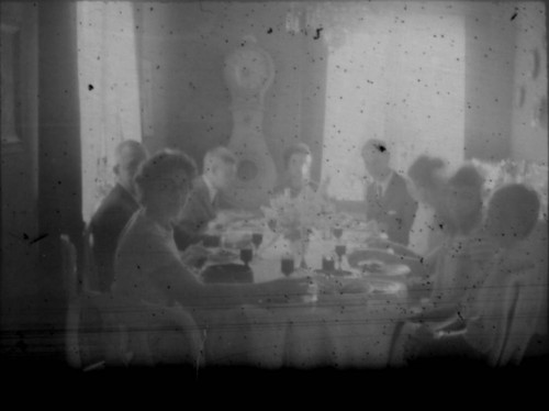 Unidentified group of people gathered at a table