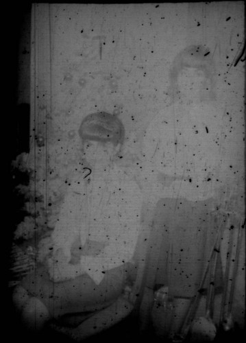 Two unidentified women, one seated, one standing (Peters relatives?)