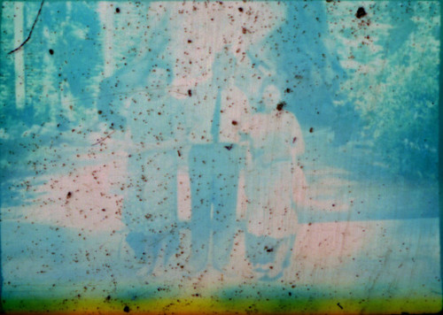 Alice Peters with unidentified man and woman standing on a forest road