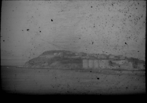 View of unidentified village and mountains
