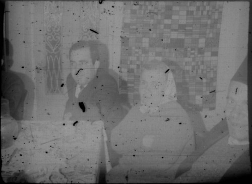 Group of unidentified people sitting at a table