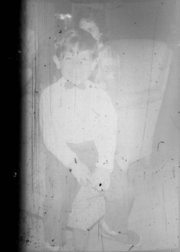 Unidentified young boy and woman