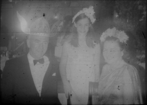 Unidentified man and two women wearing party attire aboard the M/S Stella Polaris