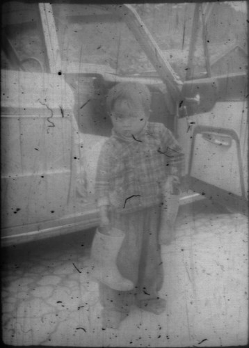 Japanese child holding boots