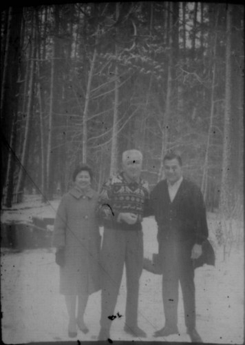 Alice Peters with two unidentified men (Peters relatives?) standing in the snow