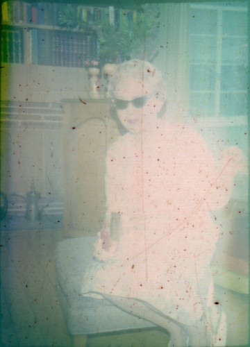 Unidentified woman seated on an ottoman