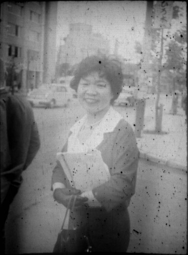 Woman standing on street corner