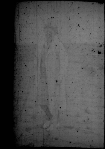 Unidentified woman (Peters relative?) standing in the desert