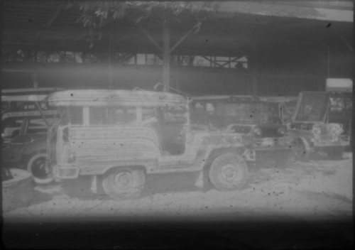 Parked cars in front of a garage