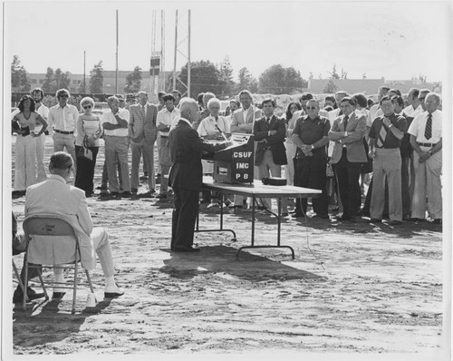 Leon Peters speaking to group at Bulldog Stadium construction site