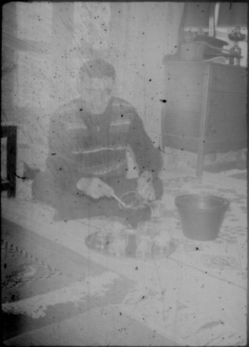 Unidentified man serving tea