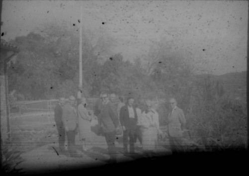 Group of tourists gathered at unidentified monument