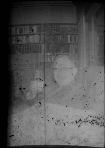 Unidentified man (Peters relative?) holding up drink