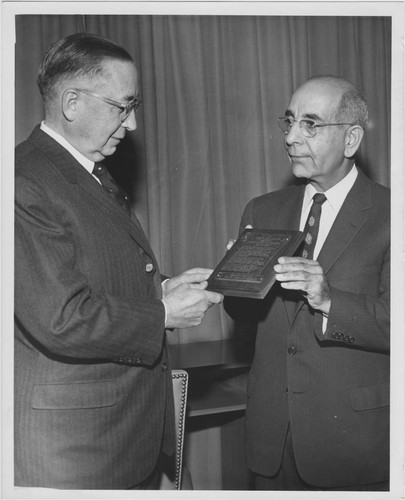 Leon S. Peters presenting unidentified award
