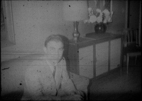 Unidentified man seated on a couch