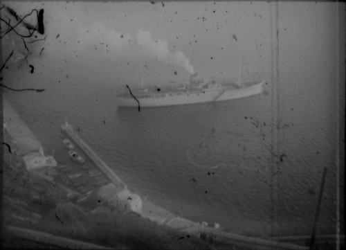 View of cruise ship in unidentified harbor