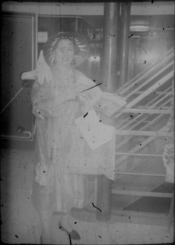 Alice Peters at bottom of stairwell aboard cruise ship