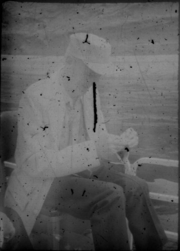 Unidentified man (Peters relative?) sitting in a boat