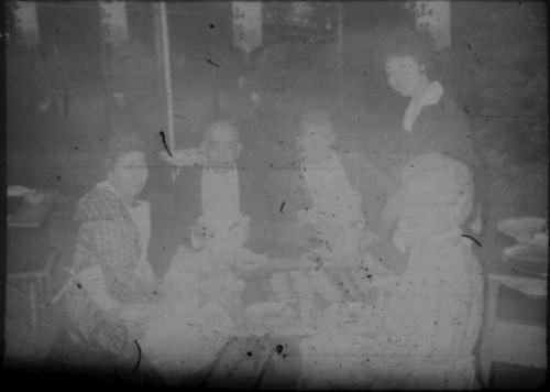 Leon and Alice Peters with others eating at a restaurant