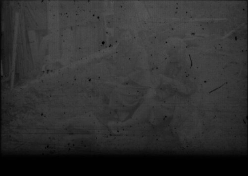 Alice Peters and unidentified woman sitting in front of cabin at Myrtle Lake