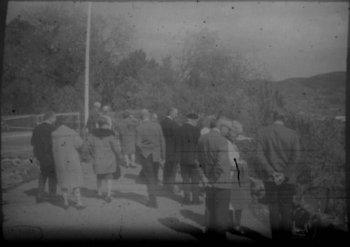 Group of tourists gathered at unidentified monument