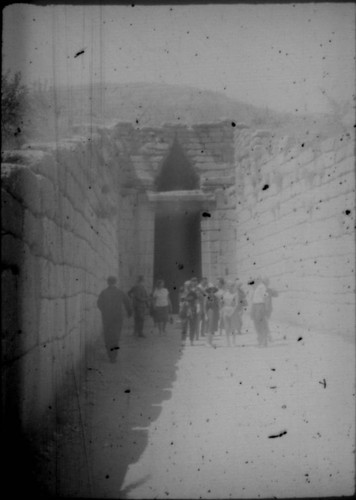 Group of tourists standing in front of the Treasury of Atreus in Mycenae