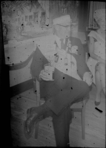 Unidentified man and woman seated aboard cruise ship
