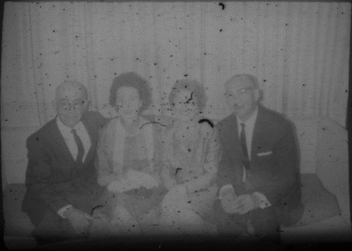 Leon and Alice Peters with others sitting on a couch