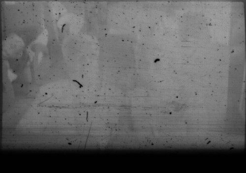 Unidentified couple seated on a train