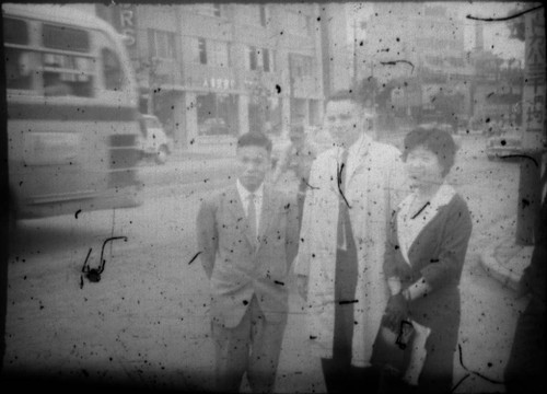 Doctor and others standing on street corner