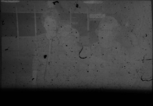 Two unidentified women standing in airport