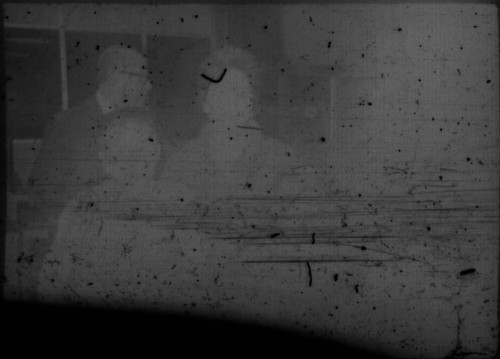 Two unidentified women and one unidentified man in airport