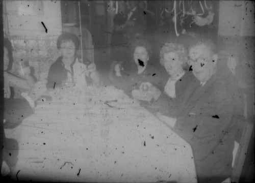 Alice Peters and others (Peters relatives?) seated around a table