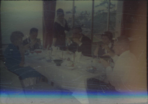 Leon and Alice Peters with others eating at a restaurant
