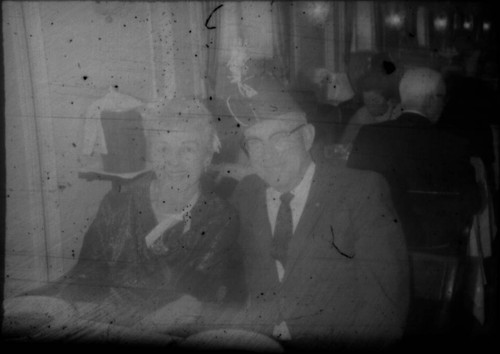 Unidentified man and woman wearing party attire aboard the M/S Stella Polaris