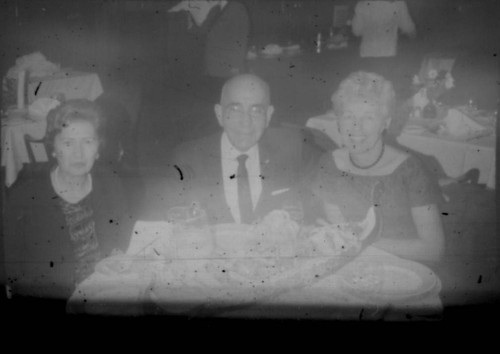 Leon and Alice Peters with unidentified woman at a table