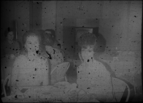 Two unidentified women seated at a table (Peters relatives?)