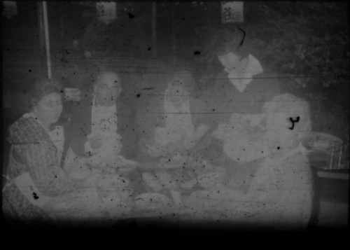 Leon and Alice Peters with others eating at a restaurant