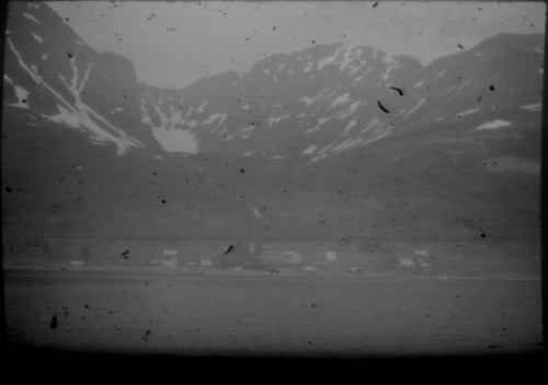 View of unidentified village and mountains