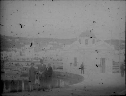 Alice Peters with unidentified couple in front of harbor